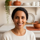 Portrait of a diverse woman in her mid-30s, smiling warmly at the camera, conveying trust and satisfaction.
